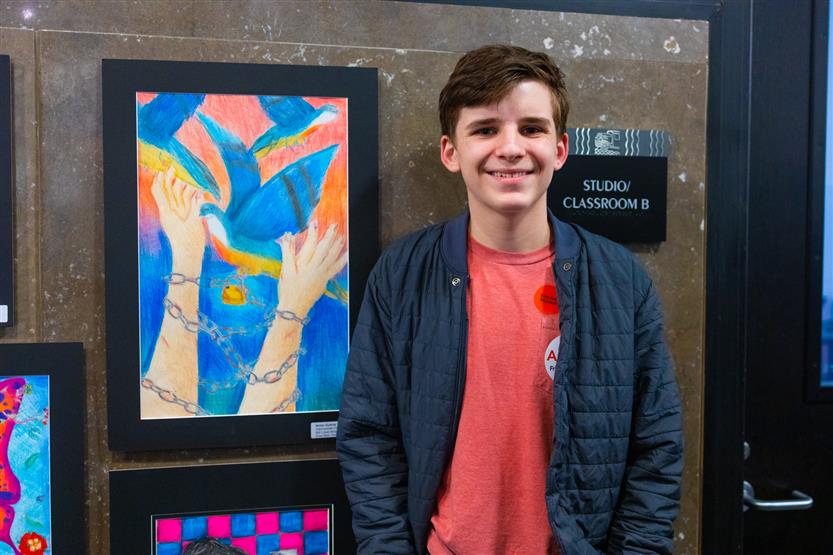 Students and their family at an art show